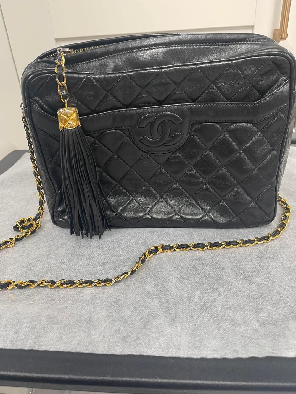 CHANEL Black Quilted Leather Crossbody with Gold Chain & Tassel